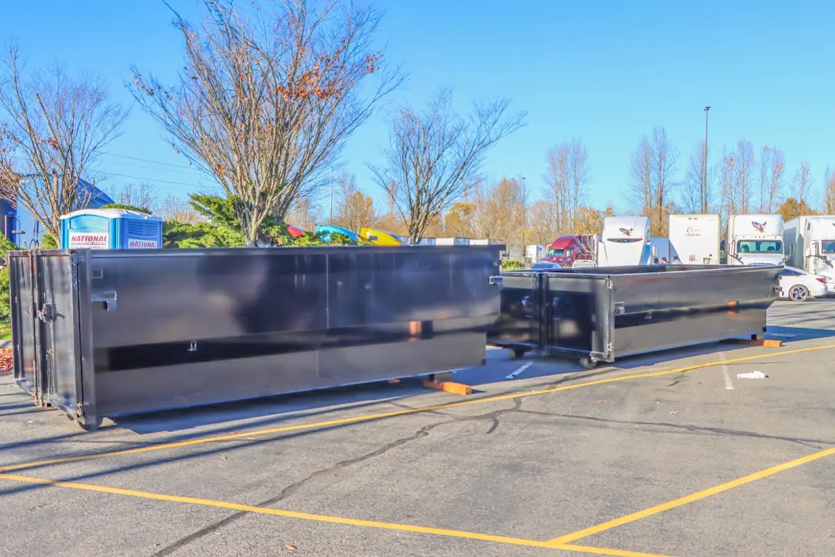 Professional dumpster rental service with roll-off container on residential driveway in Mahomet